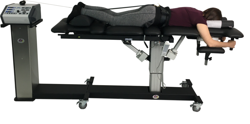 Non-Surgical Spinal Decompression table with someone lying prone.